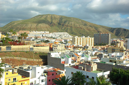 Los Cristianos, Tenerife, Canary Islands, Spain - January 9, 2011: small town and tourist resort in south-west coast of the island, in Arona Municipality with Montana de Guaza in the backgroundのeditorial素材