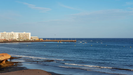 El Medano, Tenerife, Canary Islands, Spain - March 27, 2019: view of the volcanic beach towards the...