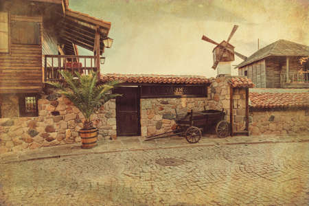 Ancient street in the old town of Sozopol, Bulgaria. Grunge and retro style.の写真素材