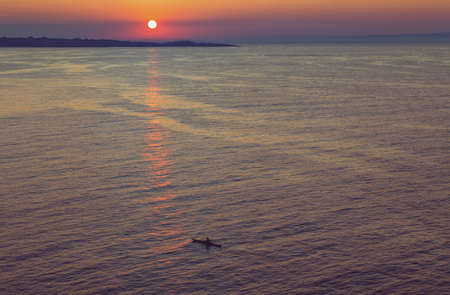 Purple sunset at the seaの写真素材