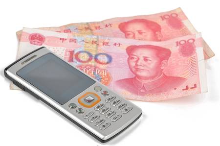 Mobile phone and chinese currencyの写真素材