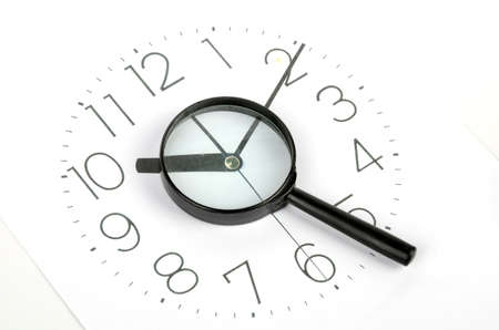 Clock face and magnifierの写真素材