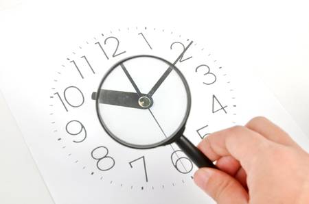 Clock face and magnifierの写真素材