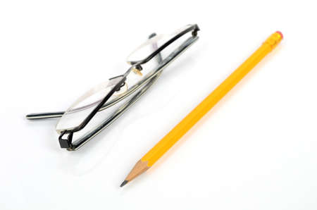 Eyeglasses and pencilの写真素材