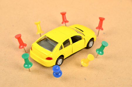 Toy car and push pin
