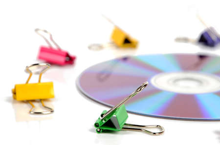 Paper clips and DVDの写真素材