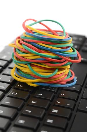Computer keyboard and rubber bandsの写真素材