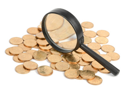 Coins and magnifier