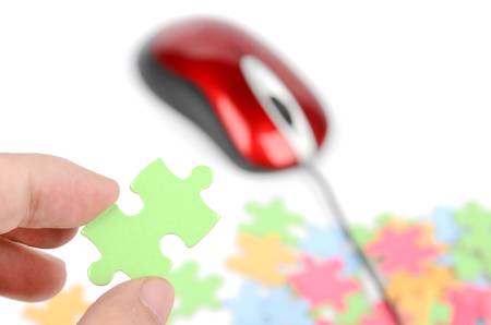 Computer mouse and puzzleの写真素材