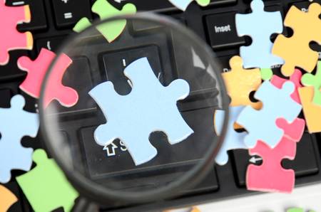 Keyboard,magnifier and puzzleの写真素材