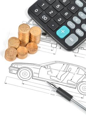 calculator and coins on car blueprintの写真素材