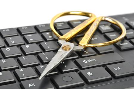 Scissors and computer keyboardの写真素材