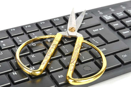 Scissors and computer keyboardの写真素材