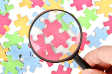 Puzzle and magnifierの写真素材