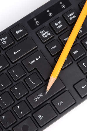 Computer keyboard and pencilの写真素材