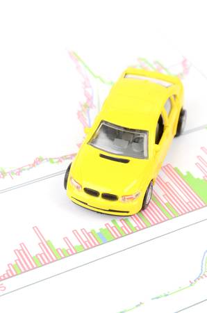 Toy car and financial graphの写真素材