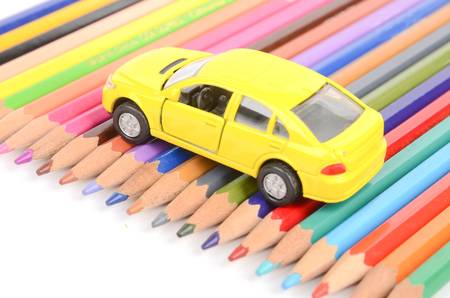 Color pencils and toy carの写真素材