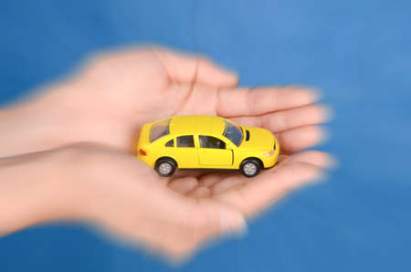 Toy car in handの写真素材