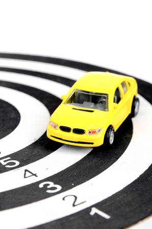 Dart board and toy carの写真素材
