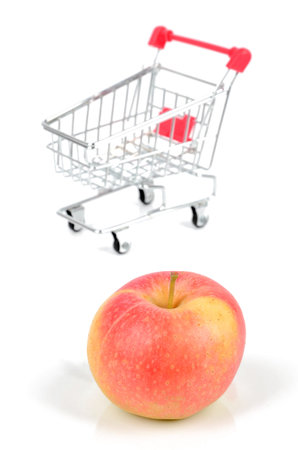 Apple and shopping cartの写真素材