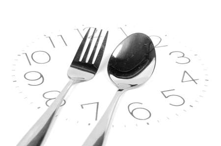 Fork on clock faceの写真素材
