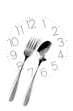 Fork on clock faceの写真素材