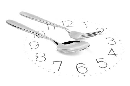 Fork on clock faceの写真素材