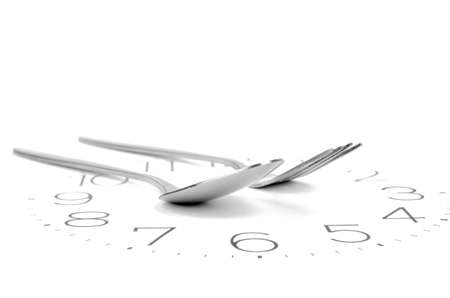 Fork on clock faceの写真素材