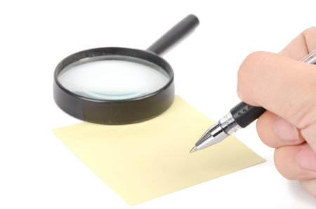 Magnifier,pen and notepaperの写真素材