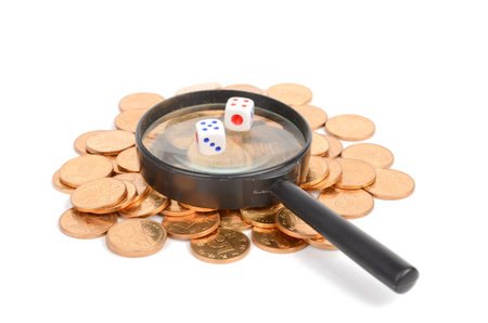 Dice,magnifier and coinsの写真素材