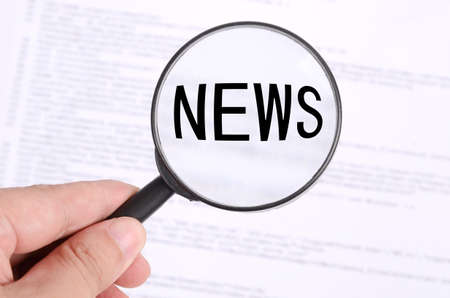 Magnifying glass in handの写真素材