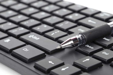 Computer keyboard and penの写真素材