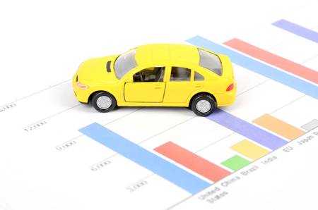 Business chart and toy carの写真素材