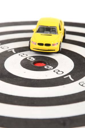 Toy car on dart boardの写真素材