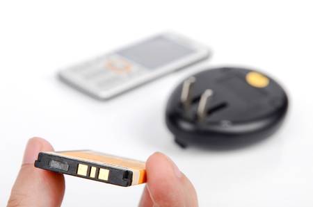 Mobile phone battery and chargeの写真素材