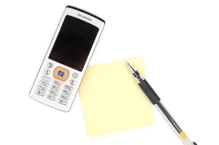 Mobile phone,pen and notepaperの写真素材