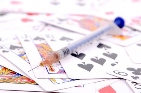 Syringe and pokerの写真素材