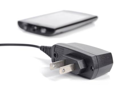 Mobile phone and chargerの写真素材