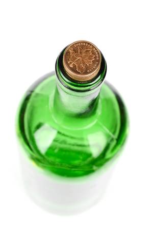 Coins and wine bottleの写真素材
