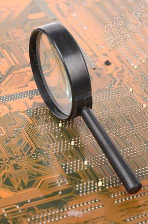Computer mainboard and magnifierの写真素材