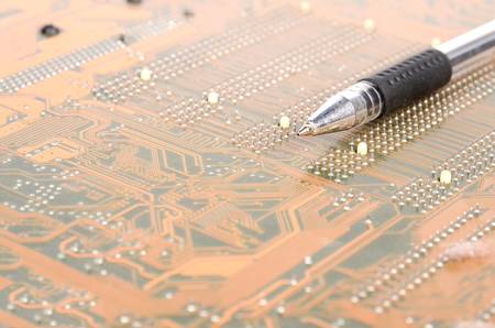 Computer mainboard and penの写真素材