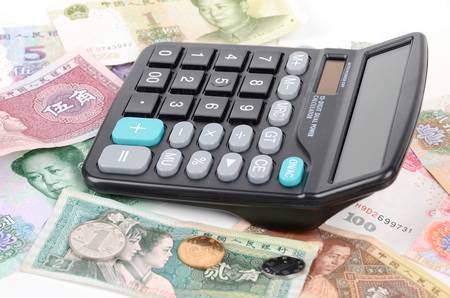 Calculator and chinese currencyの写真素材