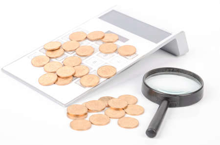 Calculator and magnifier with coinsの写真素材