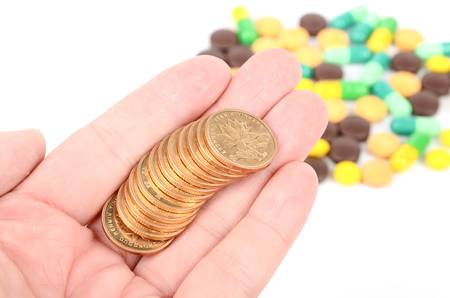 Medicine and coinsの写真素材