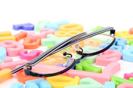 Eyeglasses and lettersの写真素材