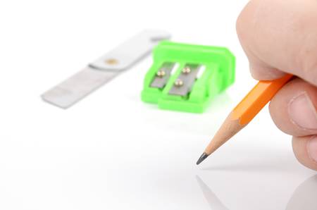 Paper knife and pencil with sharpenerの写真素材