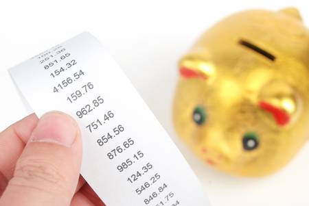 Piggy bank and receiptの写真素材