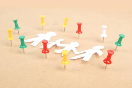 Paper man and push pinの写真素材