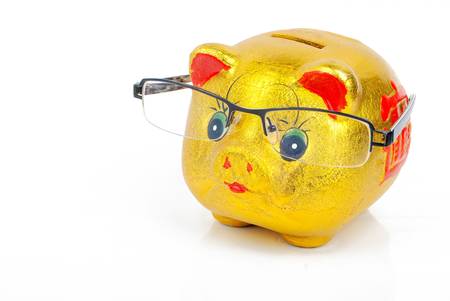 Piggy bank and glassesの写真素材