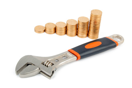 Wrench and coins